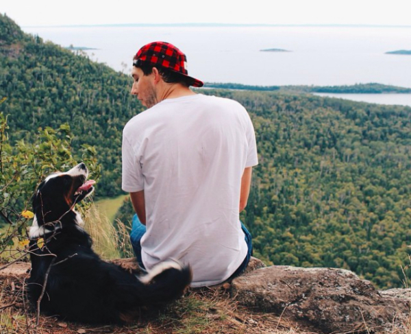 man and his dog on flipping mountain