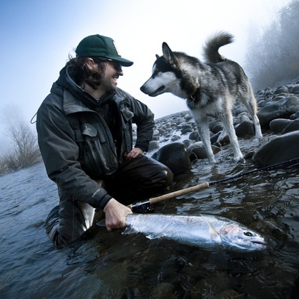 man and dog fishing together
