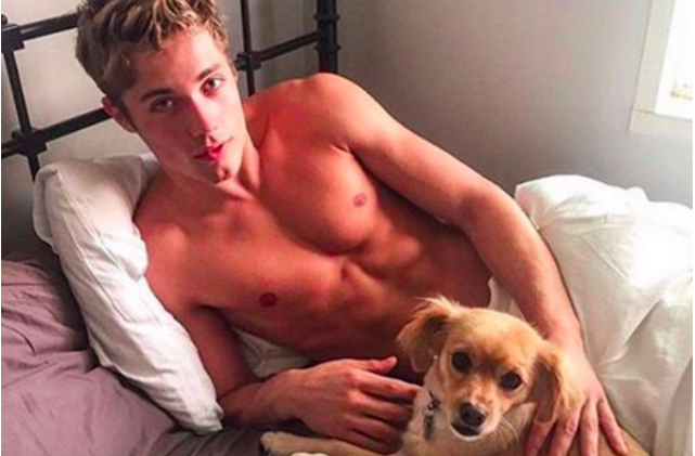 dog and guy in bed
